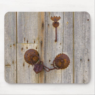 Rusty vintage old iron padlock on a wooden door - mouse pad