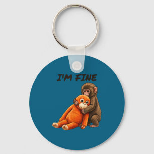 Sad monkey punch meme with an orange toy i'm fine key ring