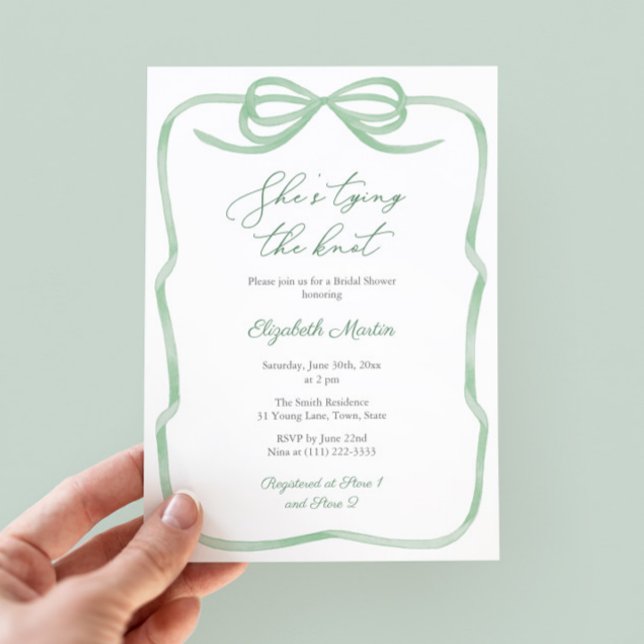 Sage Green Bow She's Tying The Knot Bridal Shower Invitation (Sage green tying the knot bridal shower invitation with watercolor bow and green white stripe backer)