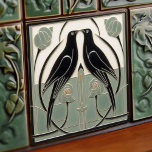 Sage Green Mackintosh Black Birds Art Deco Decor Ceramic Tile<br><div class="desc">This ceramic tile features two black birds and intricate floral patterns reminiscent of the iconic style of Mackintosh. He was a prominent Scottish architect, designer, and artist of the Art Nouveau movement. Clean lines, geometric shapes, and a strong sense of symmetry characterise his work. These elements are beautifully represented in...</div>