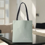 Sage Green Minimalist Modern Monogram Elegant  Tote Bag<br><div class="desc">Introducing our Sage Green Minimalist Modern Monogram Elegant Collection: Elevate your aesthetic with serene sophistication and timeless elegance. Our collection showcases minimalist designs in a tranquil sage green hue, complemented by refined monograms tailored to your personal style. From polished stationery to versatile accessories, each piece in our collection is meticulously...</div>