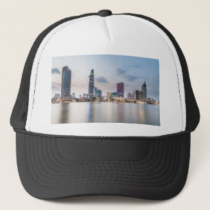 Saigon (Ho Chi Minh City) skyline at sunset Trucker Hat