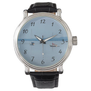 Sailboats on the river watch