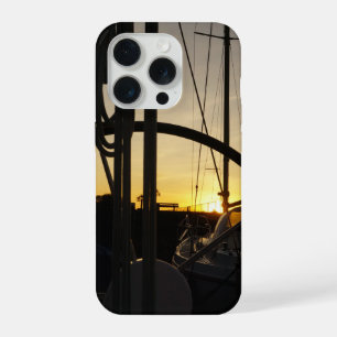 Sailing yacht steering wheel with setting sun. iPhone 15 pro case