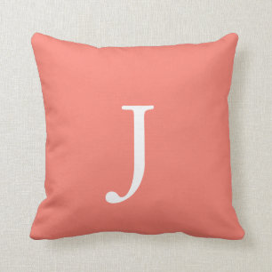 Salmon coloured monogram throw pillow