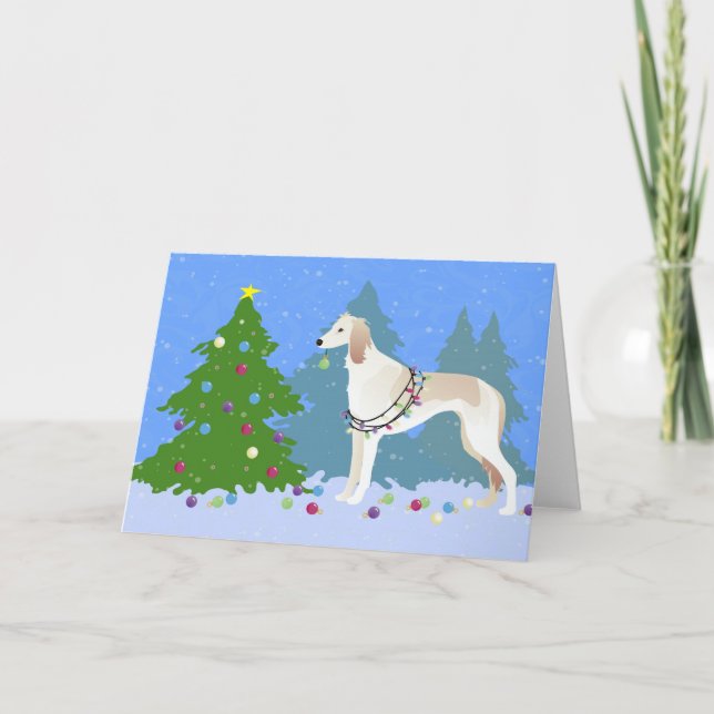 Saluki decorating a Christmas tree in the forest Holiday Card (Front)