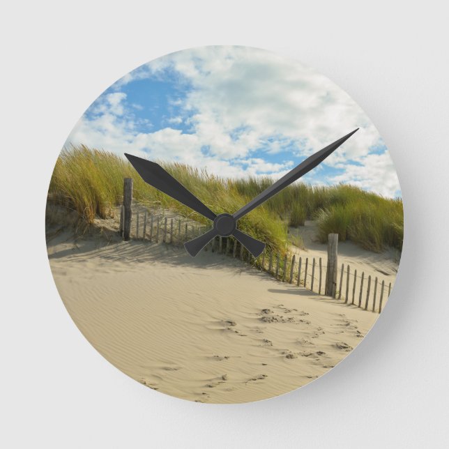 Sand dunes with wooden fence round clock (Front)