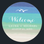 Sand, Sea and Seagulls Beach Wedding  Classic Round Sticker<br><div class="desc">Sand, Sea and Seagulls Beach Wedding Round Stickers. FROM THE SAND, SEA & SEAGULLS WEDDING COLLECTION: This is an original design by La Bella Rue. Wedding Invitation for your Beach Wedding Theme. Background of sand and sea colours with an illustration of two seagulls flying overhead. Perfect for your Engagement Party,...</div>