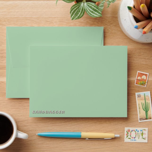 Sandbagger green small envelopes front (Desk)