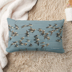 Sanderlings Take Flight in the Winter Skies Lumbar Cushion