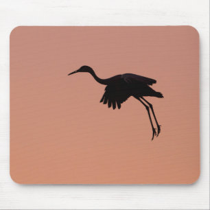 Sandhill silhouette on a pink sunset sky mouse pad