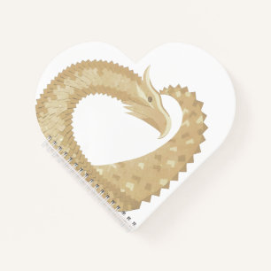 Sandstone heart dragon on white notebook