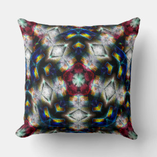 Sandy base with shapes in dark colours and lightin cushion