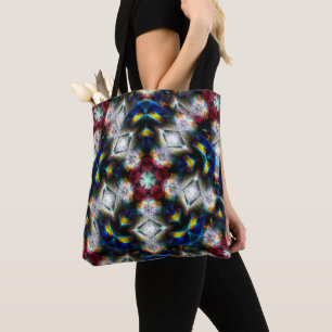 Sandy base with shapes in dark colours and lightin tote bag