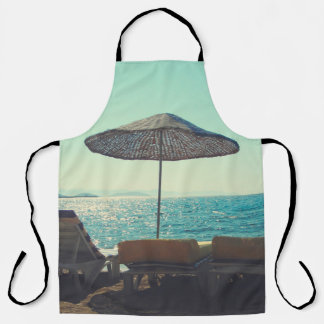 Sandy beach on a sunny afternoon,  with parasols a apron