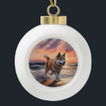 Sandy Paws Akita Dog on Beach Sunset Ceramic Ball Christmas Ornament<br><div class="desc">Immerse yourself in the tranquil beauty of our "Sandy Paws and Sunset Hues" dog on beach sunset design. This captivating scene captures the essence of a perfect evening at the shore, with a loyal canine companion enjoying the golden sands and the breathtaking hues of the setting sun. Whether you're a...</div>