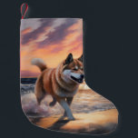 Sandy Paws Akita Dog on Beach Sunset Small Christmas Stocking<br><div class="desc">Immerse yourself in the tranquil beauty of our "Sandy Paws and Sunset Hues" dog on beach sunset design. This captivating scene captures the essence of a perfect evening at the shore, with a loyal canine companion enjoying the golden sands and the breathtaking hues of the setting sun. Whether you're a...</div>