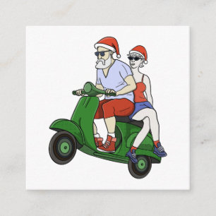 Santa and Mrs. Claus riding a scooter Enclosure Card