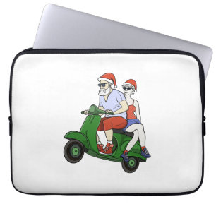 Santa and Mrs. Claus riding a scooter Laptop Sleeve
