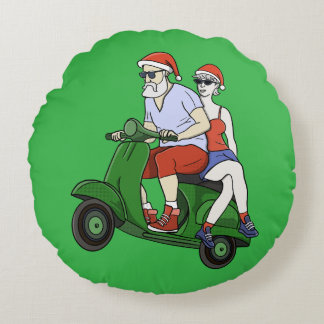 Santa and Mrs. Claus riding a scooter Round Cushion