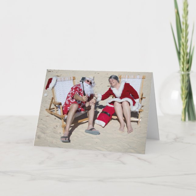 Santa and Mrs Claus taking selfie on beach Holiday Card (Front)