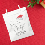 Santa Baby Christmas Baby Shower Favour Bag<br><div class="desc">Cute party favour bags for your Christmas holiday season baby shower with "Santa Baby" in an elegant script with a heart swash and a watercolor illustration of a red Santa Claus hat. Personalise with the mother's name and shower date in simple modern typography.</div>