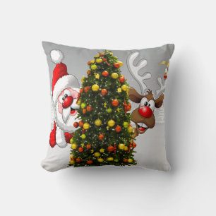 Santa claus and reindeer behind a christmas tree.j cushion