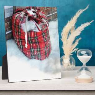 Santa Claus Bag in snow Plaque