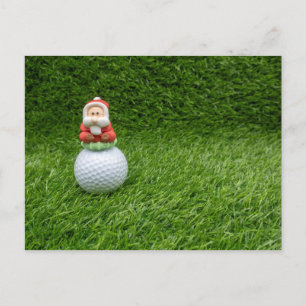 Santa Claus is sitting on golf ball Greeting Card