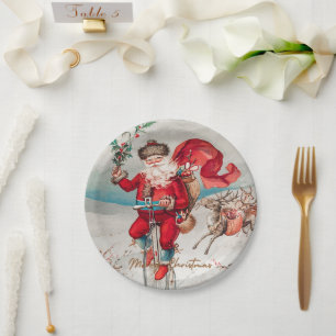 Santa Claus on a penny farthing with reindeer Paper Plate