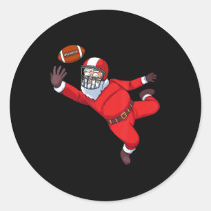 Santa Claus playing football  Classic Round Sticker