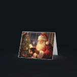 Santa Claus Reading by the Christmas Tree Holiday Card<br><div class="desc">A classic depiction of Santa Claus, dressed in his iconic red suit with white trim, sits by a beautifully decorated Christmas tree. He is reading a book, his face illuminated by the warm glow of the tree lights. The background features a window with a snowy winter scene outside, adding to...</div>