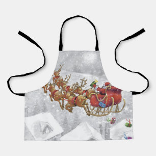 Santa Claus riding on sleigh with gift box Apron