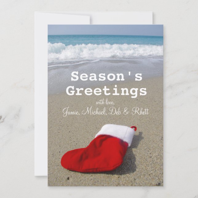 Santa Claus sock laying on beautiful beach Holiday Card (Front)