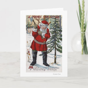 Santa Cutting Down Christmas Tree Holiday Card