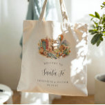 Santa Fe New Mexico Desert Wedding Welcome Tote Bag<br><div class="desc">A warm, hand-painted watercolor tote featuring a curated Santa Fe vignette filled with adobe architecture, turquoise accents, desert botanicals, pottery, and a soft Southwest sunset palette. Designed as a chic welcome gift for your Santa Fe bachelorette weekend, this tote feels equal parts artful and practical. Personalised with the couple’s names...</div>
