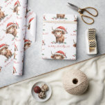Santa Hat Highland Cow Script Merry Christmas Wrapping Paper<br><div class="desc">Santa Hat Highland Cow Script Merry Christmas. A fun design with a sweet highland cow in his Santa hat. Merry Christmas is in a set stylish script.</div>