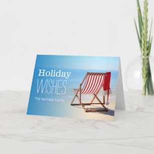Santa hat on a deck chair. Christmas at the Holiday Card