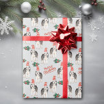 Santa Hat Siberian Husky Christmas Wrapping Paper<br><div class="desc">A beautiful Siberian Husky Dog wears a red and white striped Santa hat in the pattern on this Christmas wrapping paper. Along with the dog images are green holly sprigs with red berries, and red script text that says "Merry Christmas". The images and text are placed on a silver grey...</div>