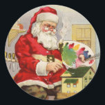 Santa Painting Doll House Classic Round Sticker<br><div class="desc">Santa is painting a doll house. Image of a Vintage Christmas Card.</div>
