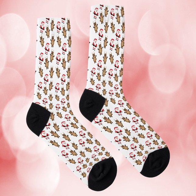 Santa Red Reindeer Pattern White Background Socks (A pair of socks with a pattern of Santa in a red suit and reindeer.)
