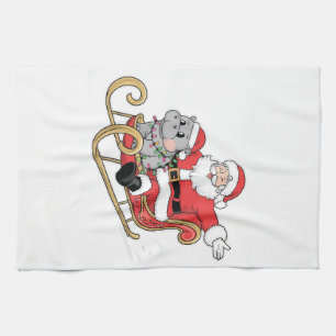 Santa Riding Sleigh with a Moo Deng Baby Hippo Tea Towel