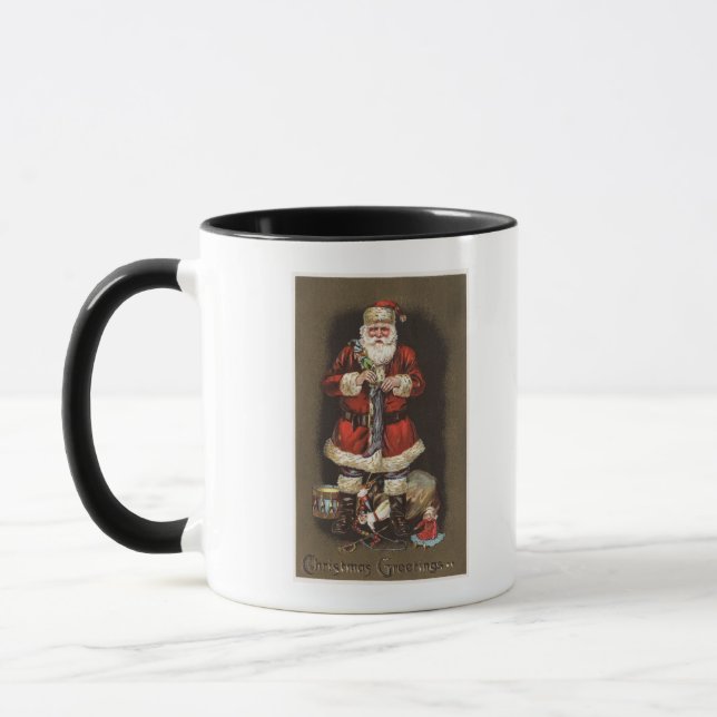 Santa Stuffing Stocking with Nutcracker Mug (Left)