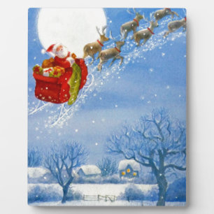 Santa with his flying Reindeer Plaque
