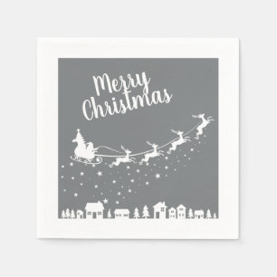 Santa's sleigh silhouette flying above the houses napkin