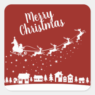 Santa's sleigh w/ reindeer flying above the houses square sticker