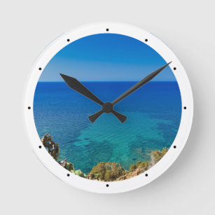 Sardinian blue sea and sky w/ mediterranean scrub round clock
