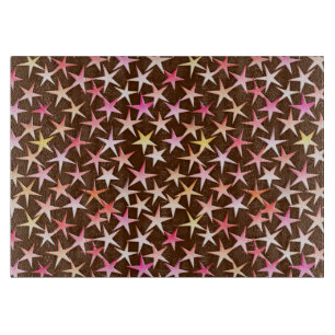 Satin stars, pink on chocolate cutting board