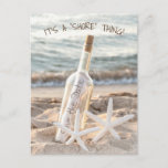 Save The Date Message In a Bottle Announcement Postcard<br><div class="desc">Pair of white starfish in beach sand with a message in a bottle for save the date event.
Text is editable.</div>