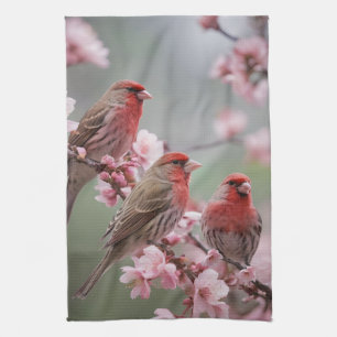 "Scarlet Trio: Red Finches Among Pink Blossoms" Tea Towel